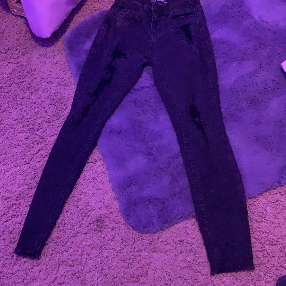 in selling these black ripped /patched jeans!
